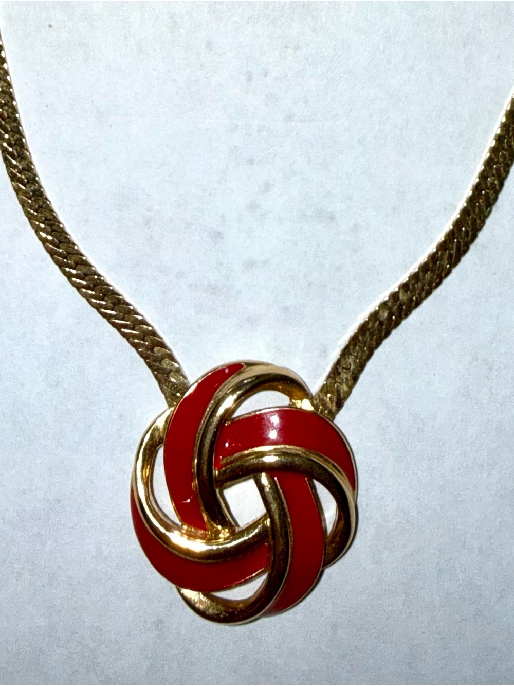 Vintage Trifari Gold-Tone Necklace with Red Enamel Love Knot Pendant